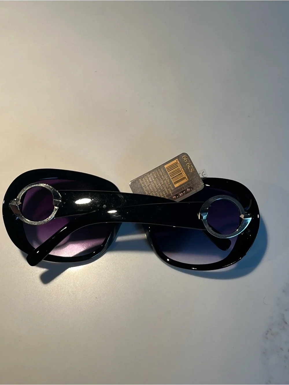NWT fabulous oversized black sunglasses with violet lenses.
